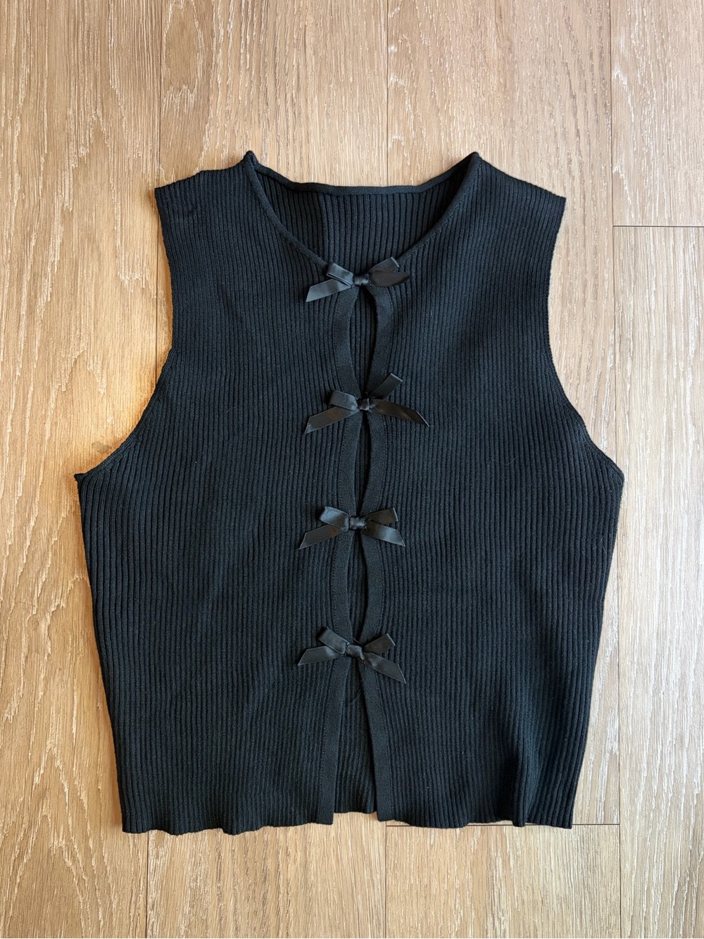 Black Sleeveless Ribbed Knit Top with Front Bow Ties